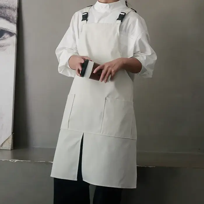 Tablier de logo personnalisé avec le coton imperméable de toile de conception divisée pour la cuisine de restaurant de café