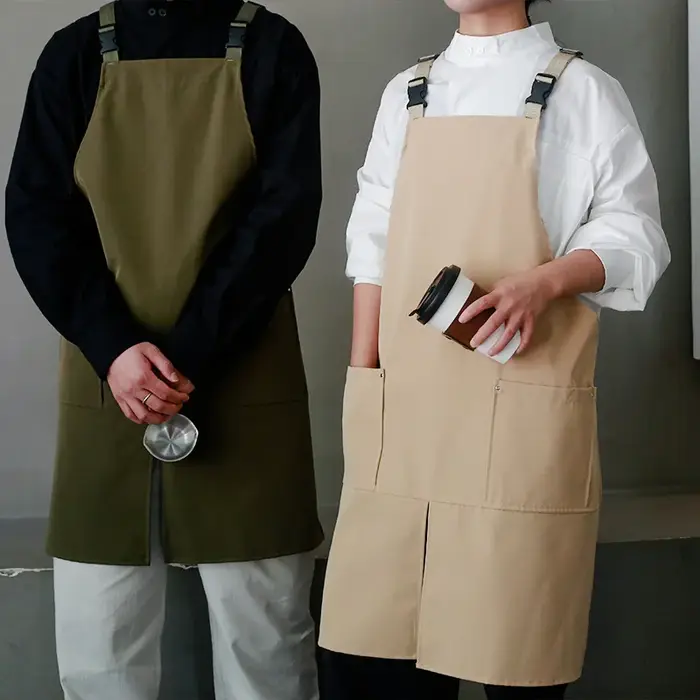 Tablier de logo personnalisé avec le coton imperméable de toile de conception divisée pour la cuisine de restaurant de café